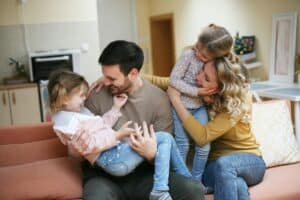 A family embrace on the sofa