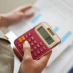 A person calculating aspects of their pension.