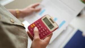 A person calculating aspects of their pension.